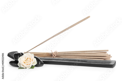 Composition with incense sticks and holder on white background