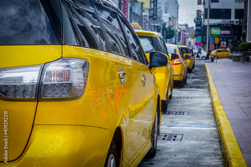 Yellow taxis in one line parking lot