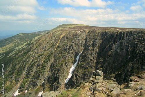 Wielki Szyszak (great Szyszak) peak. The Karkonosze slope near the cauldron of the great pond. View from the top. Remains of snow on the hill 