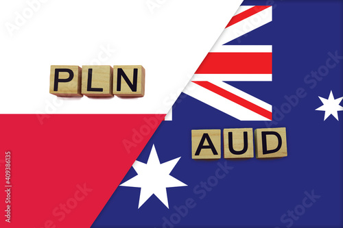 Poland and Australia currencies codes on national flags background