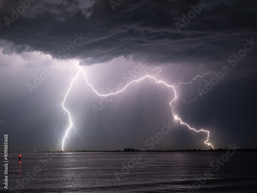 Double lightning strike in the water of the sea