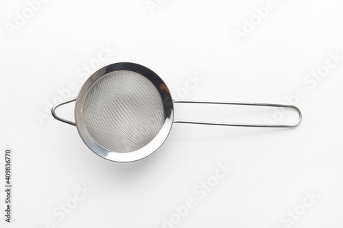 Close up of stainless steel fine mesh strainers all-purpose colander sieve isolated on white background. Copy space.
