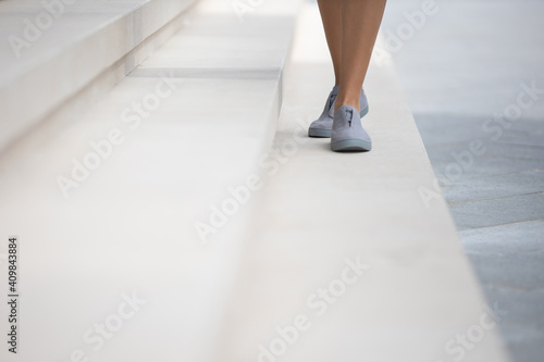 Woman wearing grey shoes outside