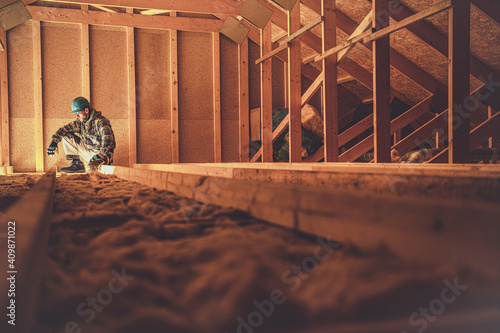 Construction Worker and the Wooden House Attic