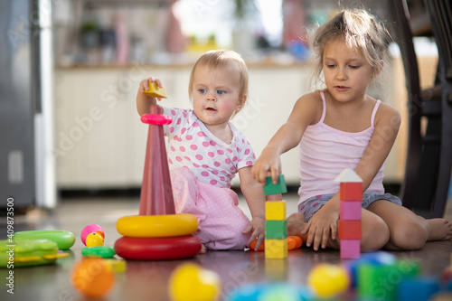 Two children play toys