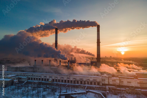 Industrial factory pollution, smokestack exhaust gases. Industry zone, thick smoke. Climate change and global warming