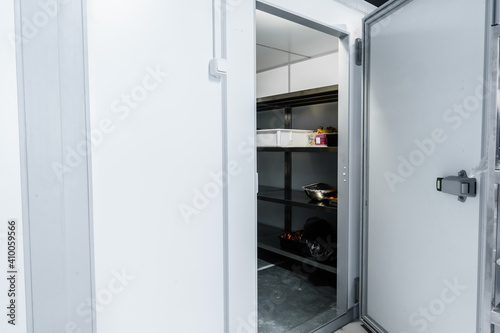 Refrigerator room door in professional kitchen in restaurant