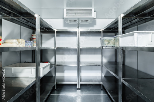 Refrigerator chamber with steel shelves in a restaurant