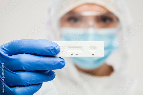 Healthcare UK NHS frontliner holding Coronavirus COVID-19 rapid diagnostic test kt