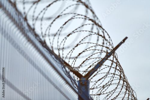 Barbed wire on fence of restricted area