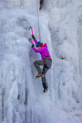 woman climbing ice