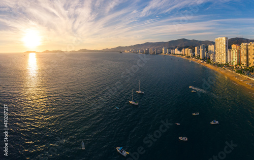 Beautiful sunset, aerial view of the beach, acapulco city seen from above. Travel and vacation concept. Colorful sunset on the beach