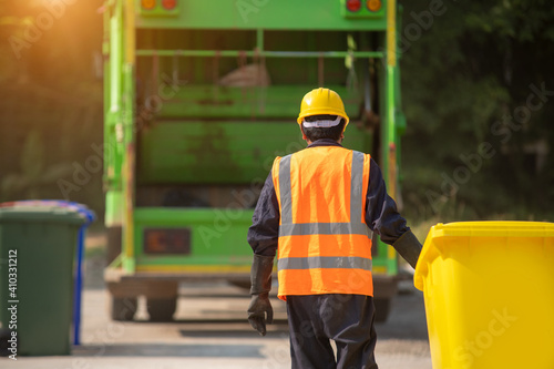 Worker collecting garbage of urban municipal are collecting for trash removal.