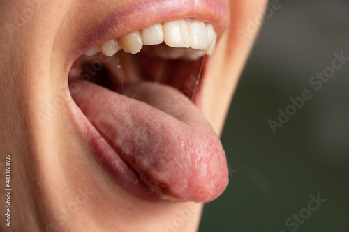 open mouth tongue lips of a young girl close-up