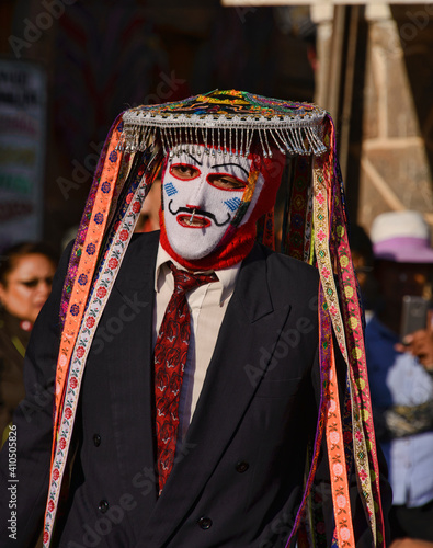 Man on a mask, participant at the wild Virgen del Carmen Festival, held in Pisac and Paucartambo, Peru