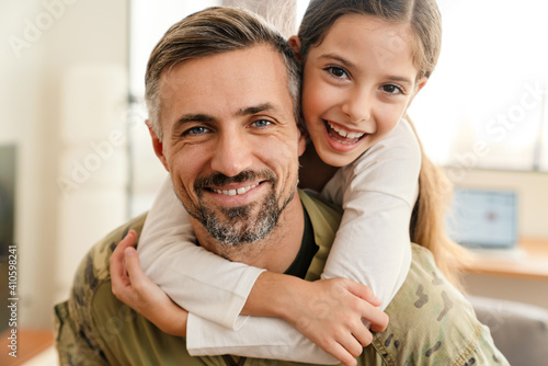 Happy military father and his daughter reunion