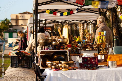 Tibetan bowls. Vintage stuff. Flea market. Golden dishes. Fair of old things. Garage sales. Antique. Second hand