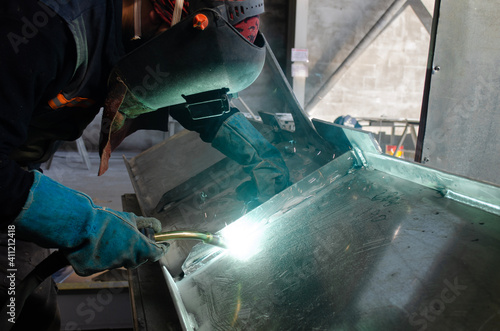 Welding Worker / Welder Doing Aluminium Weld