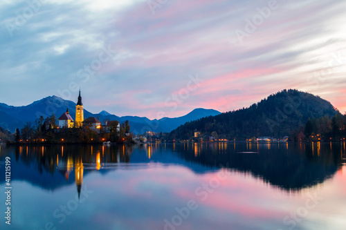 Cozy sunrise on Lake Bled against the backdrop of the castle in the Julian Alps in the Tirglav National Park