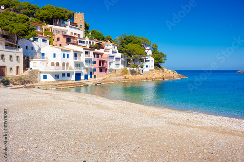 View of the beach of Sa Tuna with the houses that maintain the appearance of the old fishermen's houses creating very picturesque corners. Begur, Costa Brava, Catalonia, Spain
