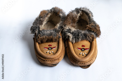 A pair of Indigenous-made, beaded rabbit fur moccasin slippers in Southwestern Ontario, Canada.