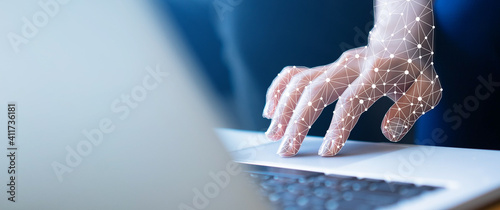 close up on robot hand working on laptop to checking correct data by using RPA function software program to help proof and detect and synchronize to system for future technology of business concept 