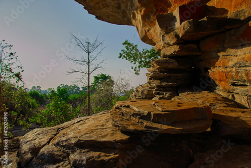 A rocky outcrop is lit by the late afternoon sun in the outback of the Northern Territory Of Australia.