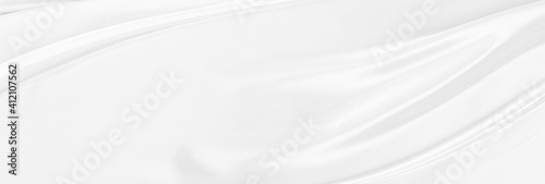 White gray satin texture that is white silver fabric silk panorama background with beautiful soft blur pattern natural.