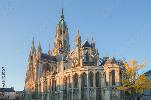 The Bayeux Notre Dame Cathedral on a sunny afternoon in the historic centre of Bayeux in Normandy, France.