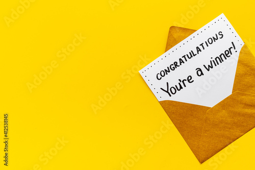 Award letter You Re A Winner in golden yellow envelope. Congratulations concept