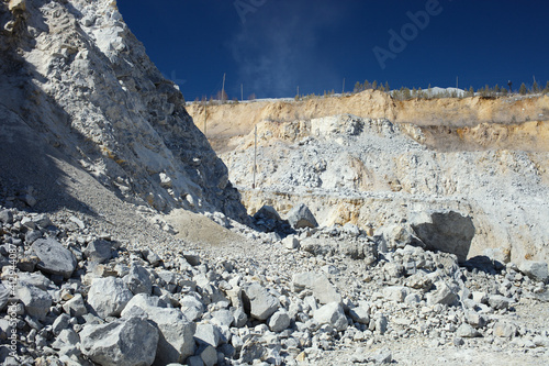 Large boulders and stone scree in a quarry for the extraction of limestone.