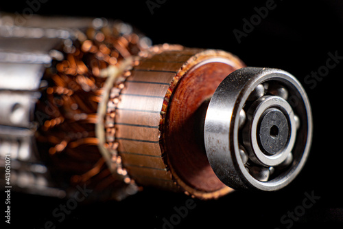 Rotor of a small electric motor. Spare parts in the electrical workshop.