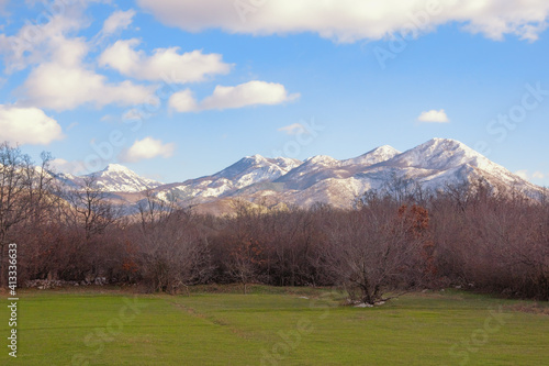Winter mountain landscape, snow-capped mountains and green grassland. Bosnia and Herzegovina, Republika Srpska