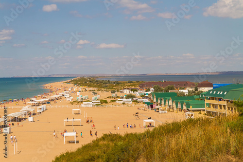 View of the beach on the Bugaz spit in Anapa in Russia. the beach is surrounded by the sea on both sides.