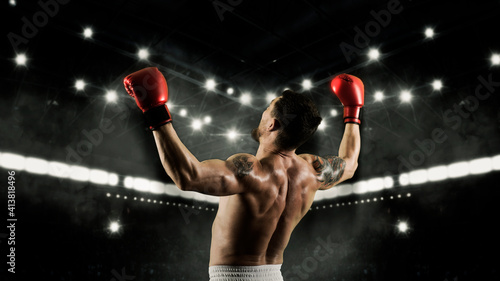 Boxer celebrating win on dark background. Sports banner