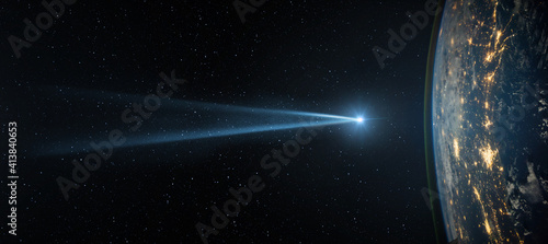 Comet, asteroid, meteorite flying to the planet Earth against the background of the starry night sky. Asteroid and the tail of a falling comet flying to Earth. Elements of this image courtesy of NASA.
