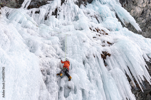 Ice climbing on frozen waterfall, Cogne, Aosta Valley, Italy