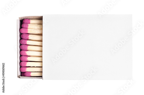 Close-up of an opened matchbox with matches isolated on white background.