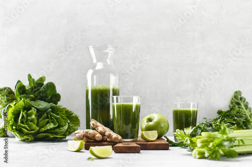 Green detox smoothies with fresh leafy vegetables and ginger