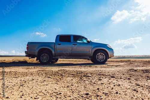 Modern pickup truck parked on countryside road