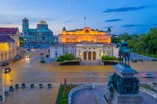 Night view of the National Assembly of the Republic of Bulgaria and Alexander Nevski cathedral in Sofia. Sign translates - Unity makes power