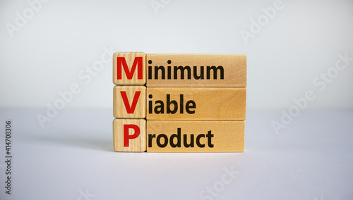 MVP, minimum viable product symbol. Wooden cubes and blocks with words MVP, minimum viable product. Beautiful white background. Business and MVP, minimum viable product concept, copy space.