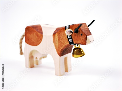 Swiss cow toy wooden handmade souvenir isolated on white background ,cow on white background 