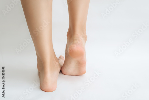 The heel of the foot is a close-up on a white background to copy the space. dead skin of the feet, the concept of foot care, pedicure