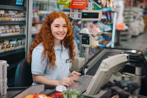 Young supermarket cashier