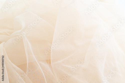 light smooth beige tulle fabric background