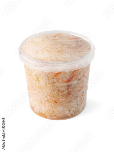 clean plastic packaging, transparent bucket with sauerkraut (fermented cabbage) side view on white background isolated with clipping path closeup. Selective focus