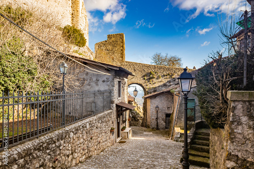 February 12, 2021 - Castel San Pietro Romano, Lazio, Rome, Palestrina - A glimpse of the medieval village, with the cobbled alley between the houses. The arch formed by the stone bridge of the castle.