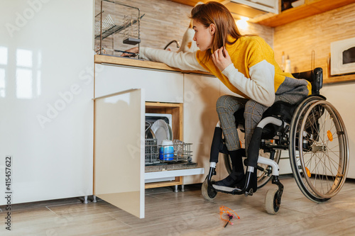 Female in wheelchair doing usual daily chores