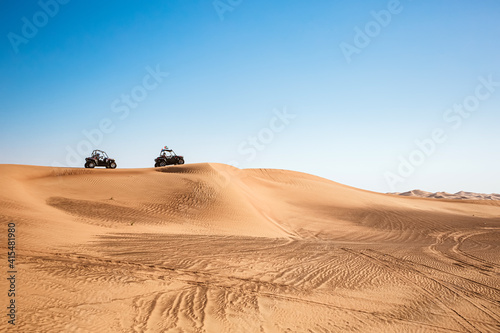 Quad buggy vehicles race at Al awir desert near Dubai, UAE, extreme sports transport, driving off-road